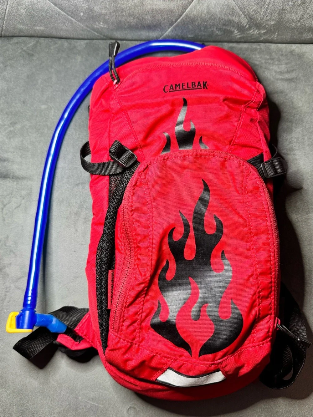 CamelBak Mini M.U.L.E. Kids’ Hydration Red Backpack with Black Flame Graphic